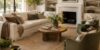 Decorate your living room in layers with a bright modern organic living room featuring a large area rug, comfortable seating, artwork, houseplants, and cozy textures.